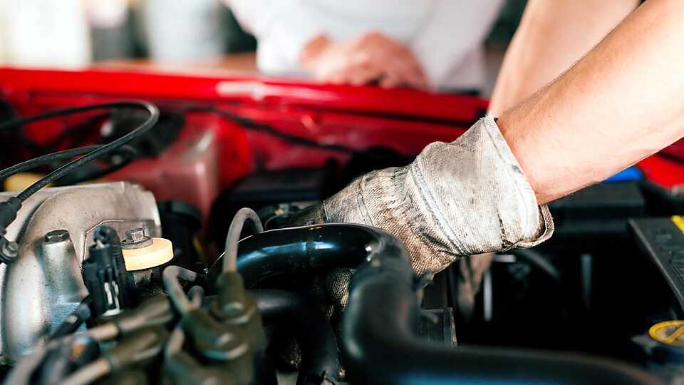 Car mechanic in repair shop